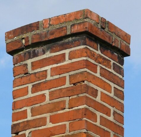 Chimney Leaks on Long Island and Why the Cap, Crown, and Flashing Matter